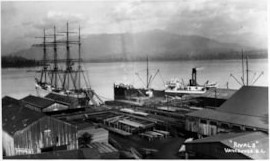 Sailing ship and steamer docked at Hastings Mill, 190-; VPL #2984